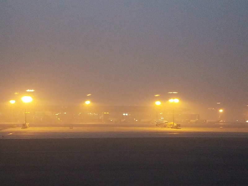 Thick smog at Beijing's Capital Airport makes an afternoon look more like dusk with the view of the terminals obscured just a few hundred yards away. Photo: Weatherboy