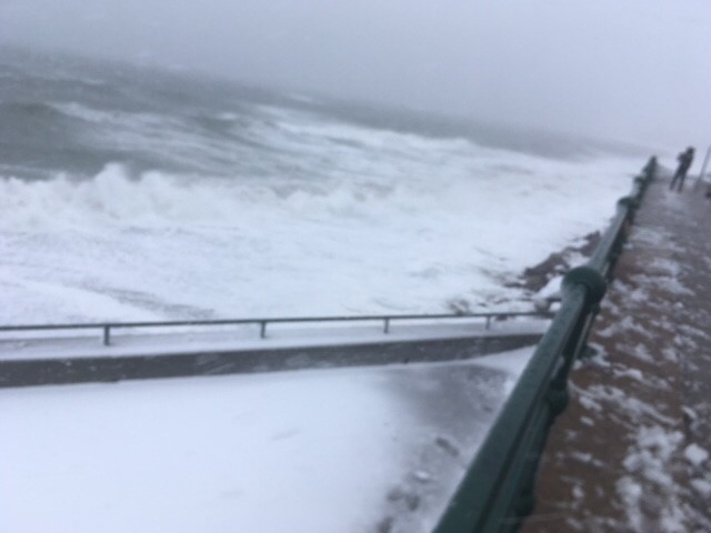 Waves crashing against the sea wall. Photo: Weatherboy