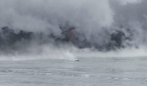 A "Hawaiian Iceberg" floats away from the ocean entry after a brief tephra explosion; the rock is buoyant due to hot gasses trapped inside. Because of the contrasting temperatures between the hot floating rock and cold seat water, the rock emits steam. May 2017 Photograph: Weatherboy