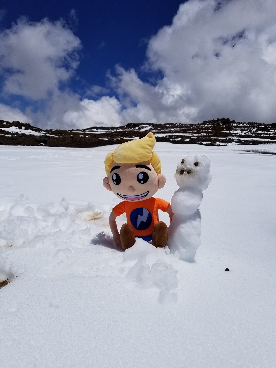 Time for fun in the snow! Weatherboy makes a snowman in the snow on top of Mauna Kea after a late season snowstorm brought heavy snow to Hawaii in May. Photograph: Weatherboy