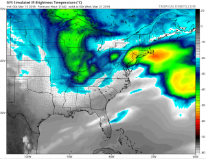 Simulated IR satellite view for Tuesday night, based on American GFS weather forecast model data, shows another storm system producing high cloud tops in orange and red across portions of the Mid Atlantic and Northeast. This is the general area that will likely see yet another coastal storm next week. Image: tropicaltidbits.com