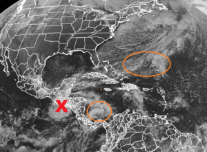 The latest GOES-East weather satellite view shows the remnants of Iota at the "X" and two circled areas of concern in the Atlantic basin. Image: NOAA
